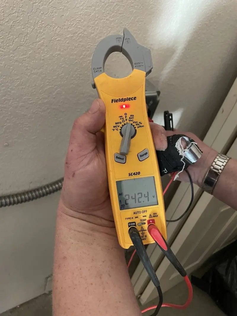Voltage testing with clamp meter during Electrical Installation Services in Prairie Village